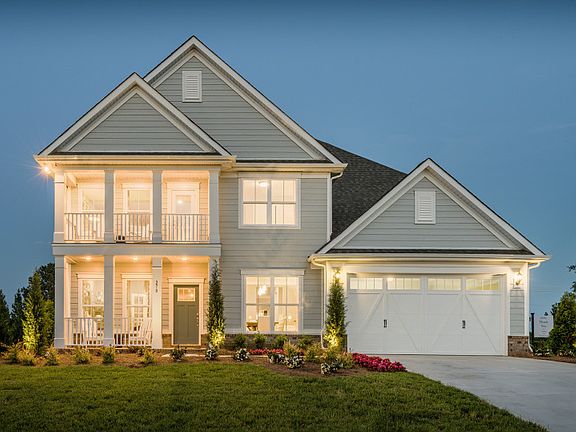 Model Home - Riverton Exterior 67 siding, double front porch deck, brick accents and 2 car front loa