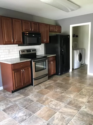 High end kitchen with granite counters and real wood cabinet - 267 Osprey Ln