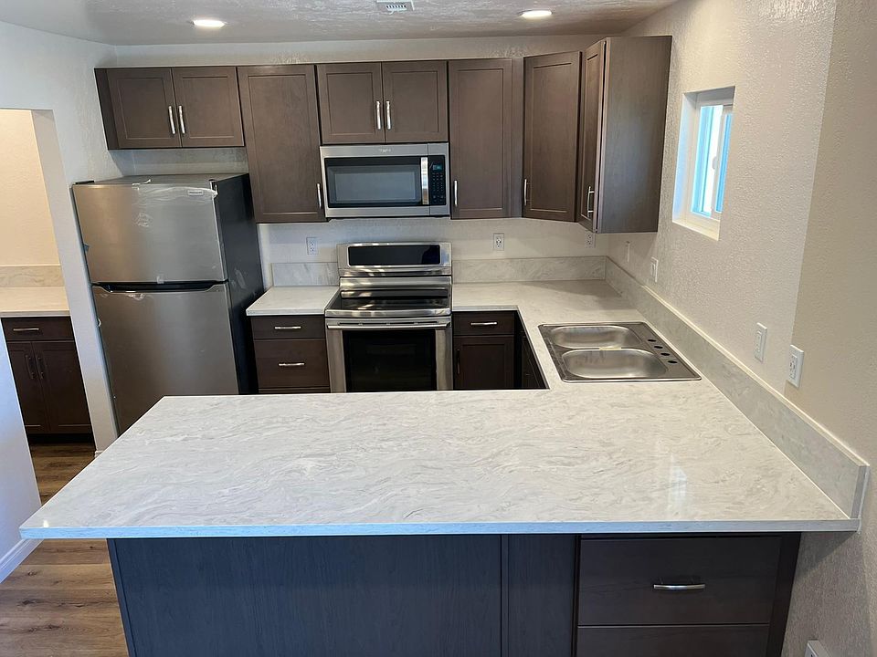 Brand new kitchen with all stainless steel appliances.