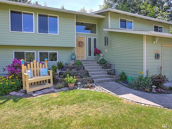 Lots of curb appeal greets you as you approach the home. Abundant windows make the space light and bright. They've been updated to vinyl double panes.