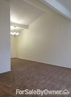 Living Room/Dining Room
						:
						Open living room and dining room features a cathedral ceiling.