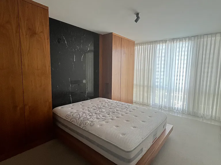Large bedroom with beautiful marble and wood accents, king size platform bed included, tons of built-in closets