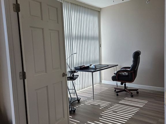 SPACIOUS DEN WITH HARDWOOD FLOORING!
