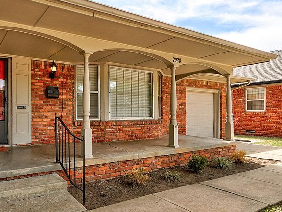 Front of house with covered front porch.