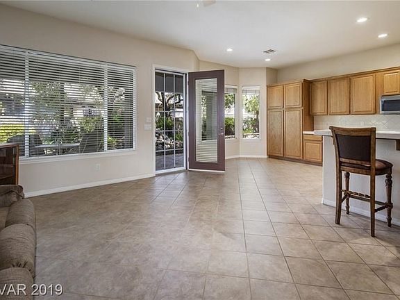 Living area & kitchen opens to peaceful backyard with covered patio