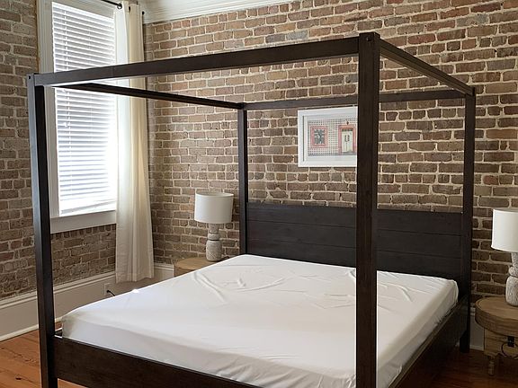 Master bedroom has En-Suite bathroom, 2 east facing windows, tall ceiling with fan, hardwood floors
