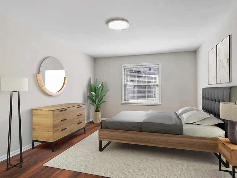 Spacious bedrooms with wood flooring throughout