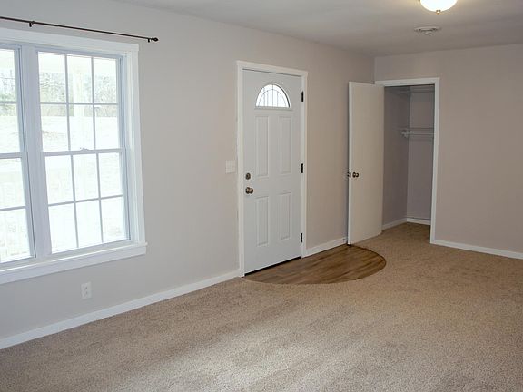 Neutral modern gray tones throughout the house, new carpet i