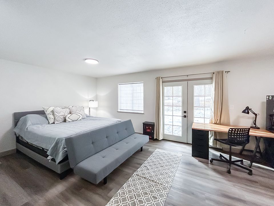 Second master suite with queen bed and private French door entrance.