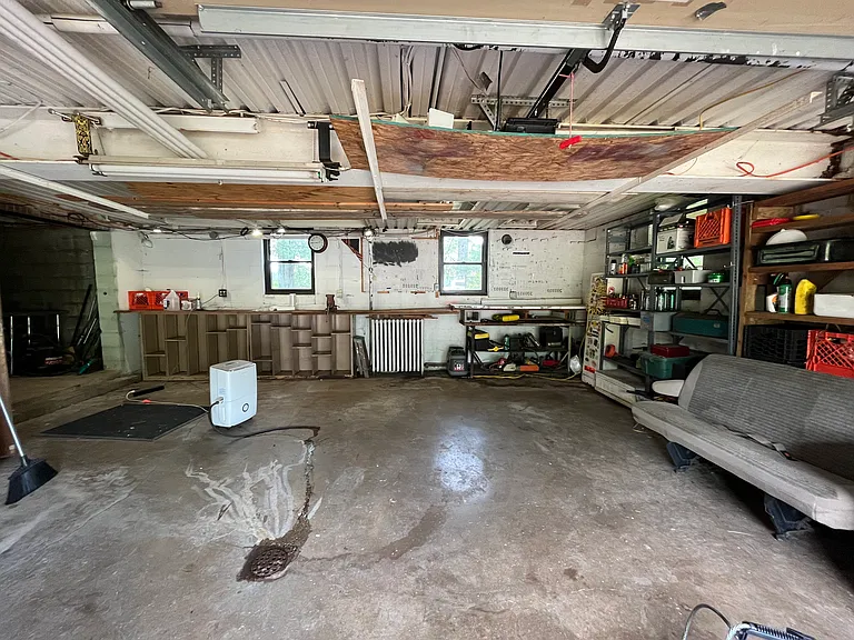 Large garage and workbench.