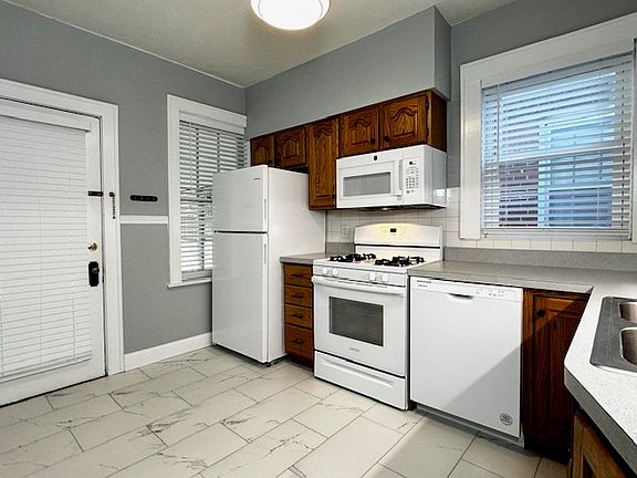 Kitchen includes refrigerator/freezer, stove, microwave, dishwasher