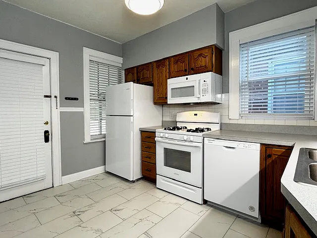 Kitchen includes refrigerator/freezer, stove, microwave, dishwasher