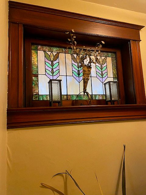 Original stain glass window in hallway.
Original woodwork.