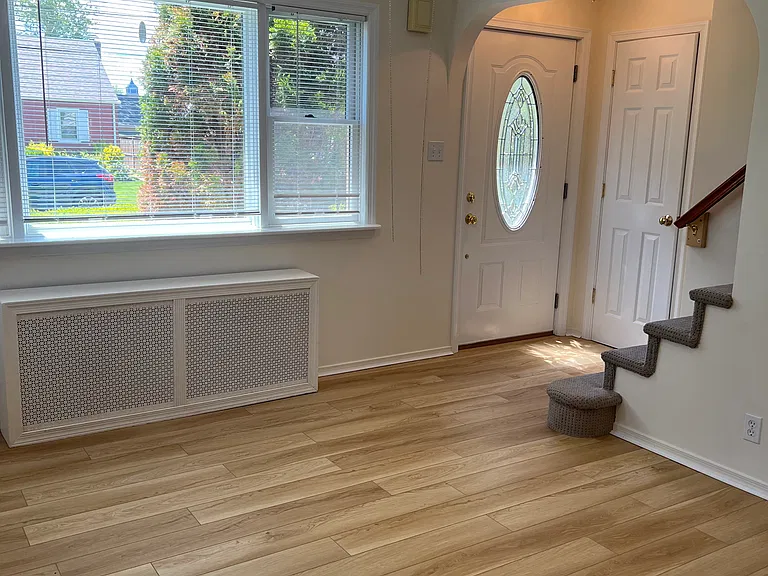 Living Room Door Entry showing stairs to 2nd floor.