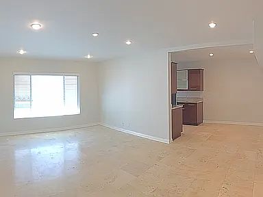 Living Room, looking at the kitchen and dinning area.