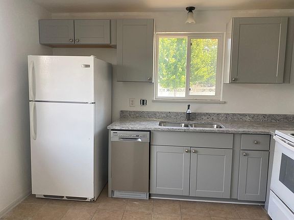 Newly updated kitchen with brand-new dishwasher, cabinets and countertop.