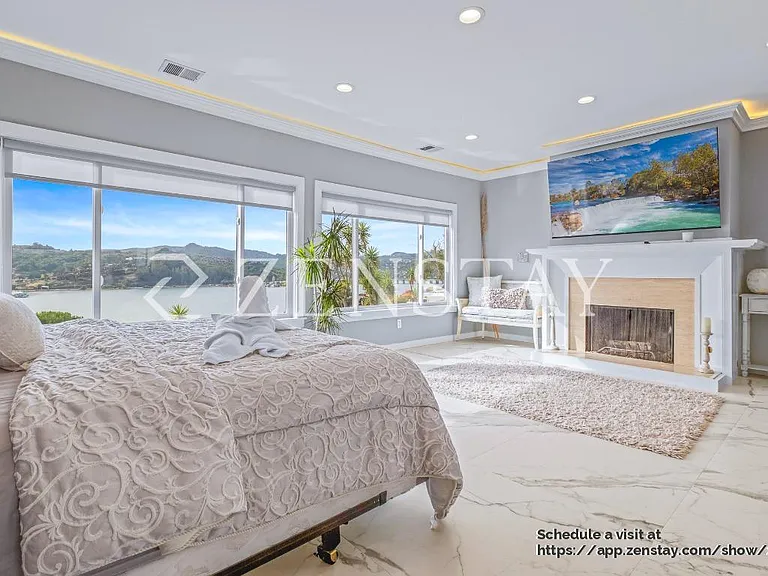 Primary bedroom with sweaping Richardson Bay views