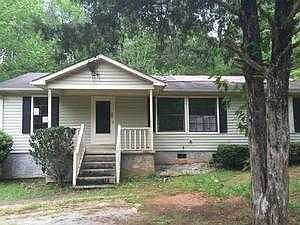 Front of house with mature trees