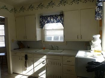 Another view of the Kitchen showing some of the extensive cupboard space.