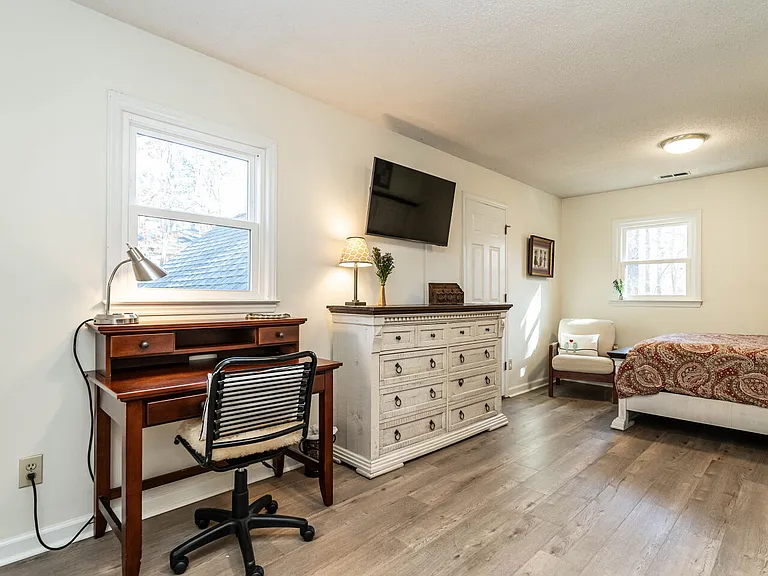 Space for work and relaxation in upstairs queen bedroom
