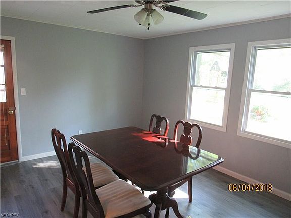 Dining room with door leading to deck and nice back yard.