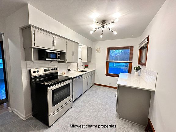 Updated stainless steel appliances, additional new cabinetry, and lighting