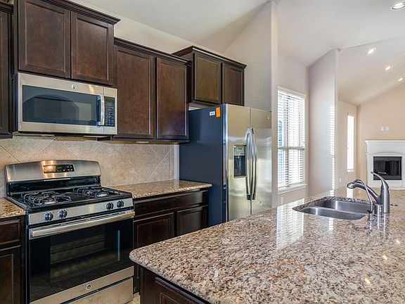 Open concept kitchen leads to breakfast nook and living room. Great for entertaining!