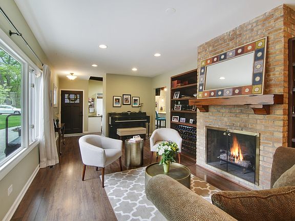 Cozy fireplace and built in shelves.