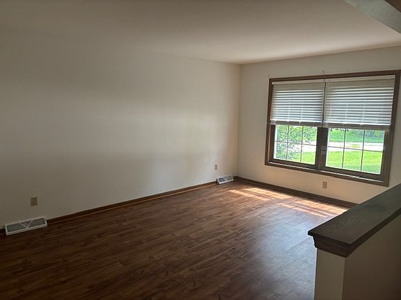 Living room all with new laminate wood flooring