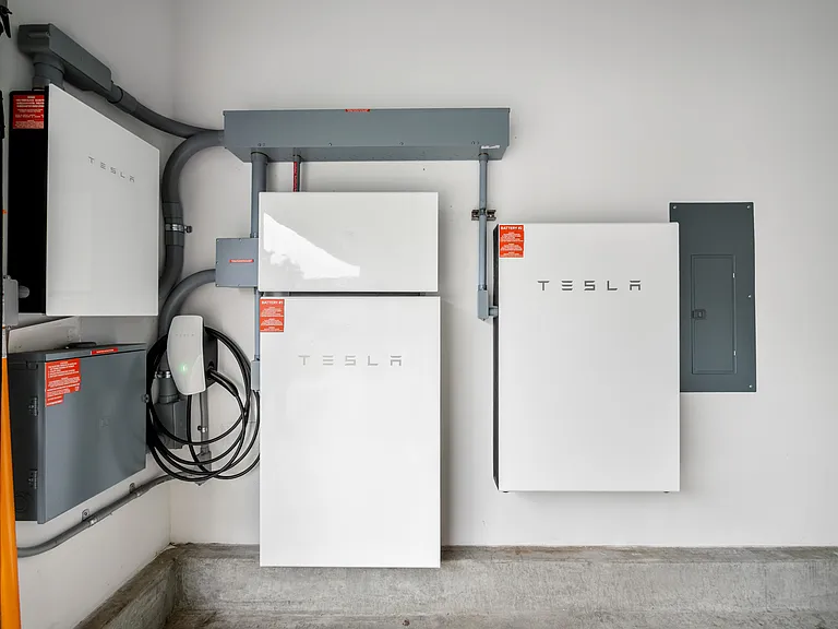 2 Tesla Batteries and Wall Connector. Second Wall Connector in garage (not shown).