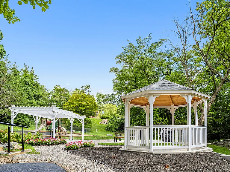 Experience tranquility in this picturesque garden oasis, complete with a charming gazebo for relaxation.