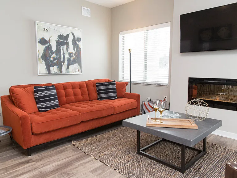 Unwind by the cozy fireplace in your stylish living room with abundant natural light.