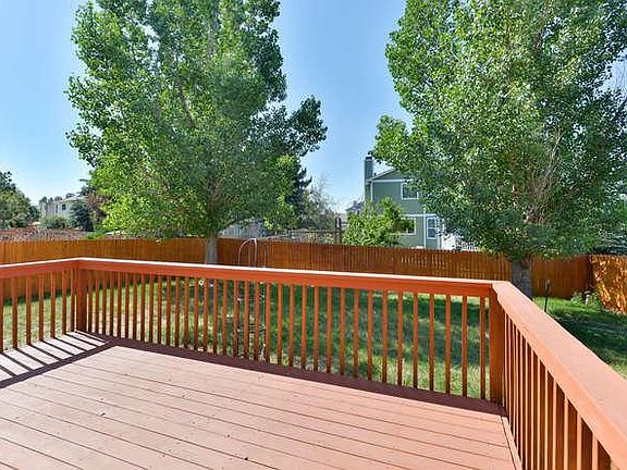 Deck overlooks backyard (just a couple of steps above grade level).
