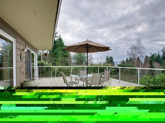 Private, entertainment sized patio to relax and enjoy the sights and sounds of this quiet Lincoln Park neighborhood! View of Puget Sound!