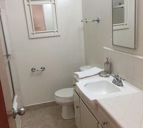 Newly reglazed tub and shower combo. New carrera marble look floor