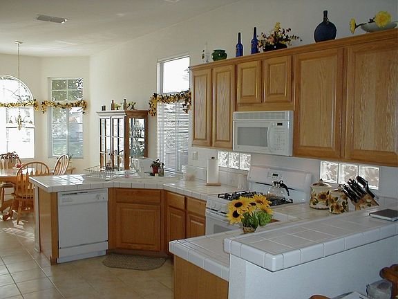 Kitchen has separate counter/ eating area.