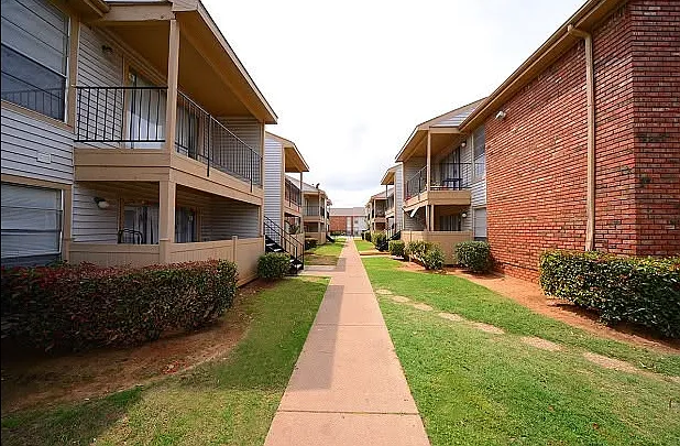 Tree-lined walkways and landscaped courtyards create a welcoming neighborhood atmosphere.