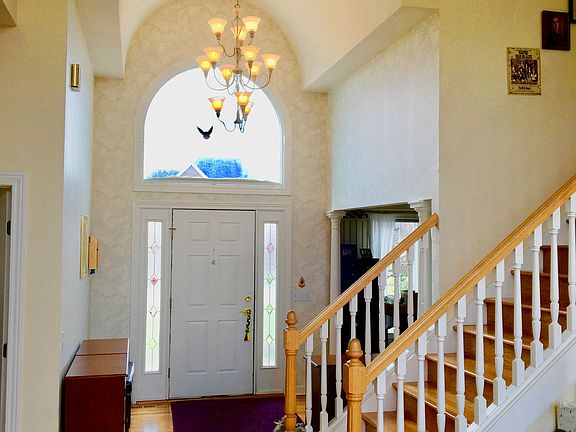Foyer arch, chandelier