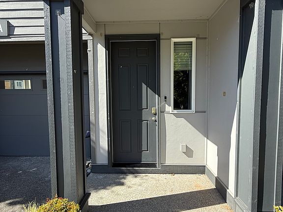 Main front door entrance with attached garage