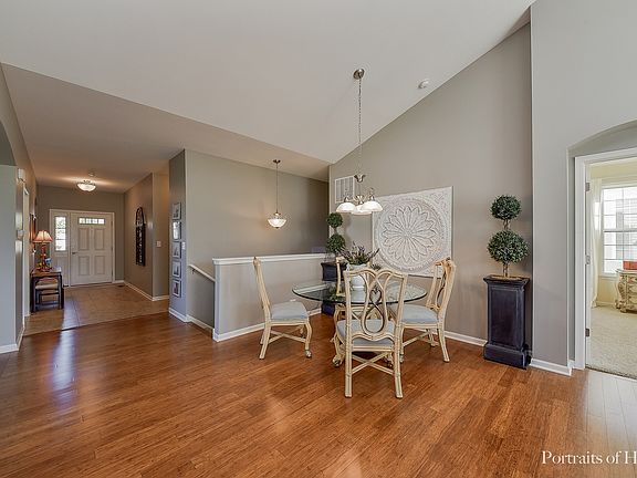 Wood Laminate; Open to Living Room and Kitchen