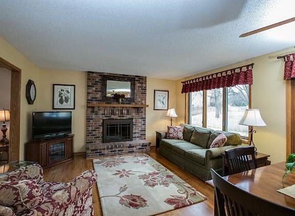 Main level family room with hardwood floors and a cozy fireplace!