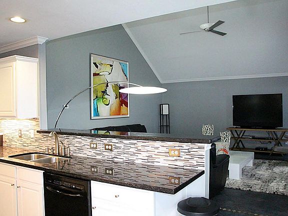 View of living room from kitchen. Plenty of counter space for entertaining .