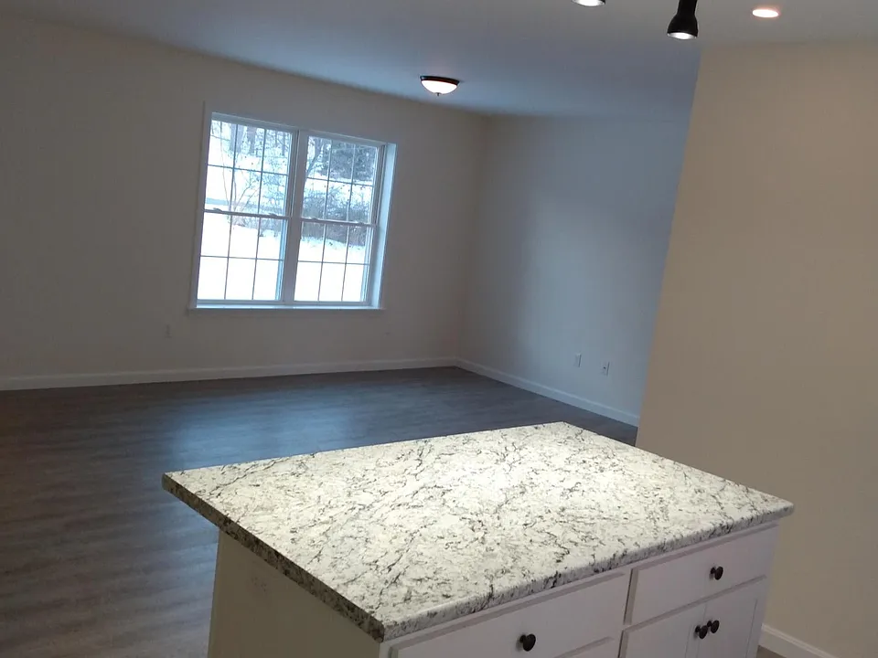 Large open concept kitchen island, livingroom.