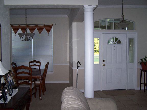 front door & column seperating dining room & living room