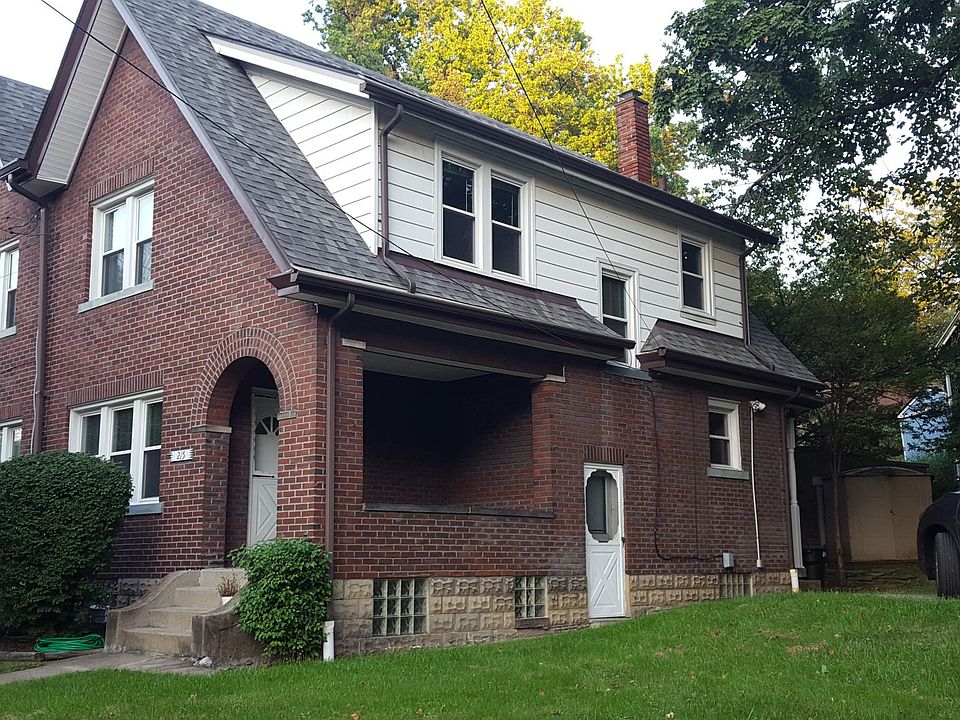Exterior with front porch and private 2-car driveway