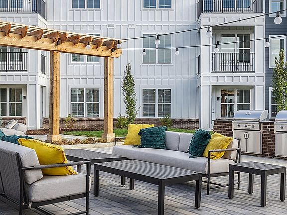 Nese's gathering spaces include an ourdoor lounge and grilling station.
