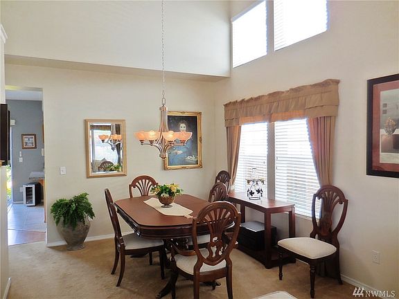 Formal Dining room with vaulted ceilings & lots of natural light.