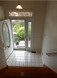 Entry with cathedral ceiling and tile floor