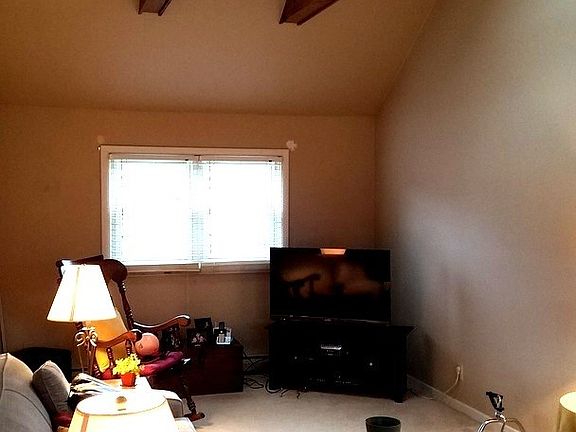 Carpeted and with 2 sky lights