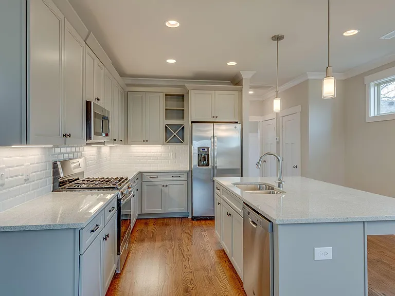 Modern cabinets and double deep stainless sinks